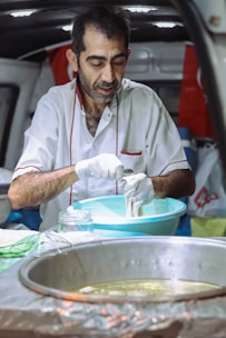 Close-up of a chef preparing fresh ingredients inside the mobile kitchen.