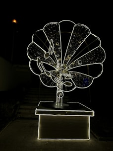 A glowing lyre intertwined with soundwave graphics against a deep navy marble background.