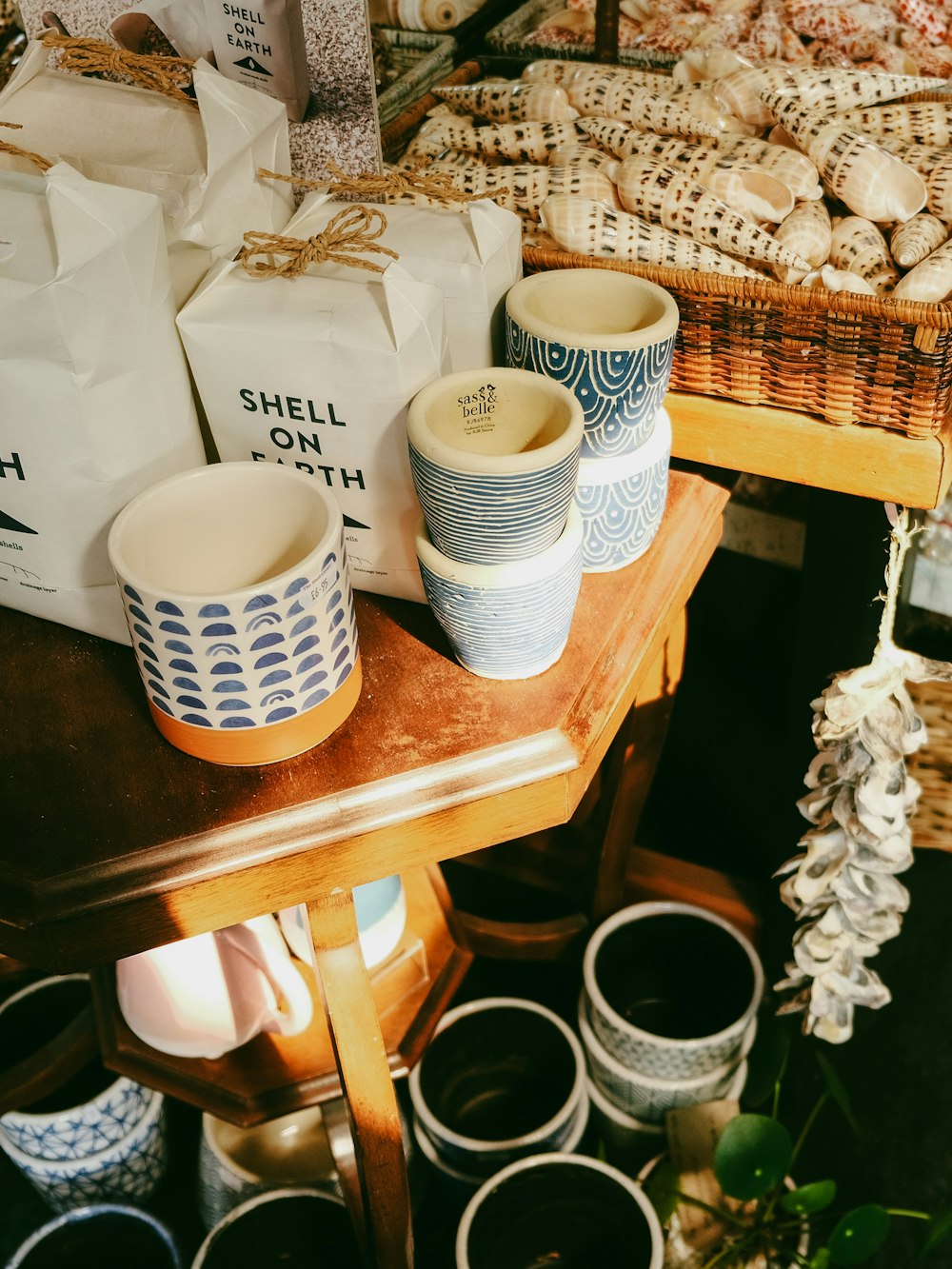 a wooden table topped with lots of cups