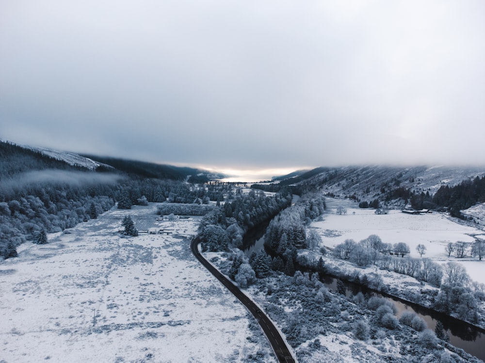 a river running through a snow covered forest