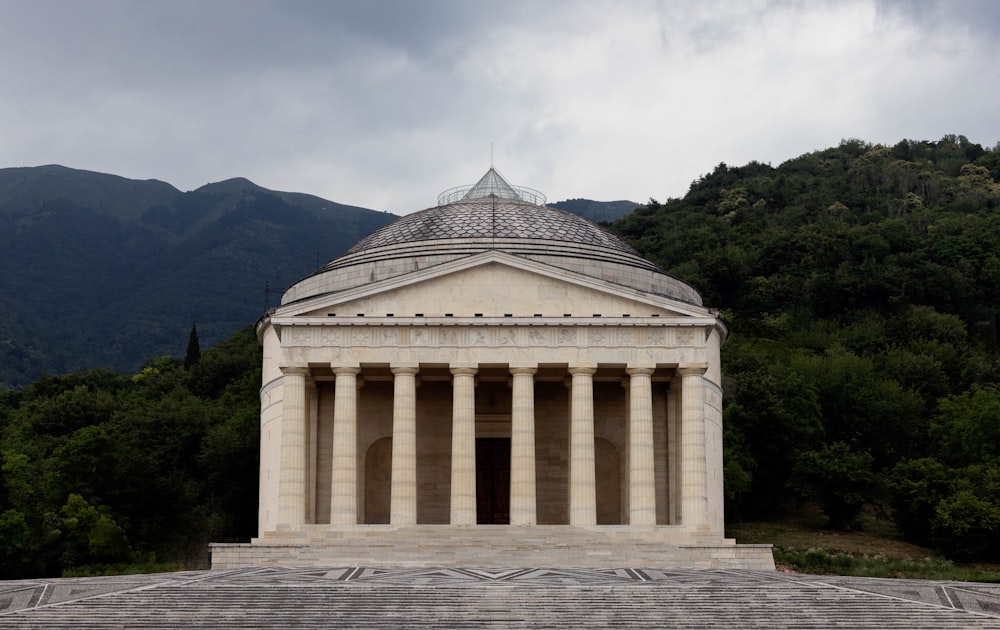 a large white building with columns on top of it