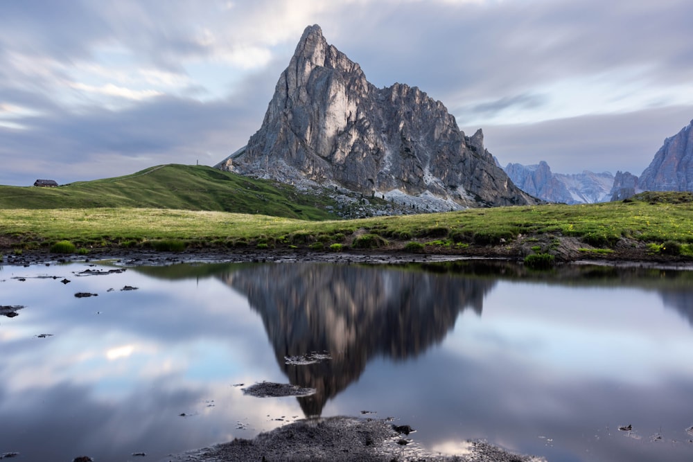 a mountain with a reflection in the water