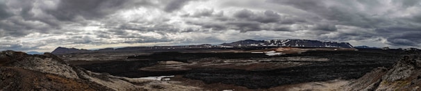 A fantasy RPG map with storm clouds gathering over rugged terrain.