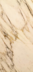A close-up of a marble surface with swirling patterns of beige, cream, and grey with subtle veins running across.