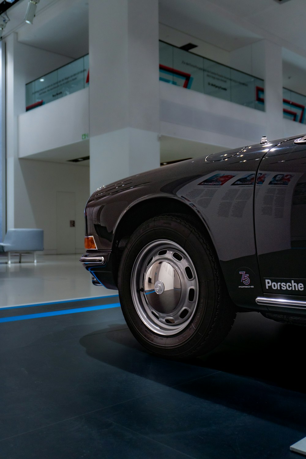 a black sports car parked inside of a building