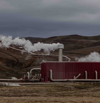 a red building with steam coming out of it