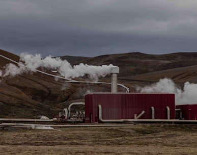 a red building with steam coming out of it