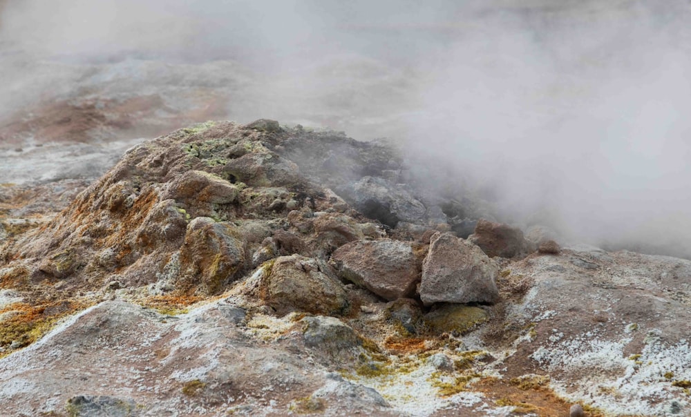 a large rock with steam coming out of it