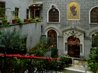 A warm, welcoming entrance of the Mercy Home for Girls in Bangalore, showing a peaceful courtyard with greenery.