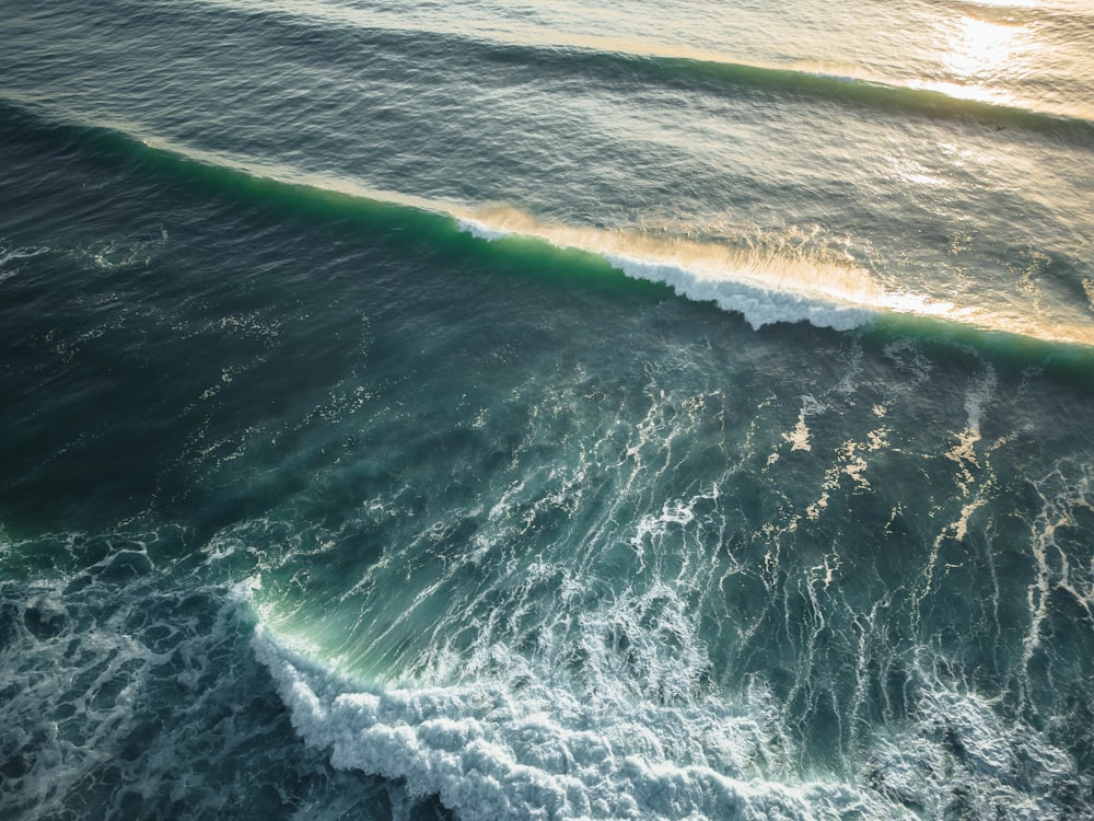 a large body of water with waves coming in and out of it