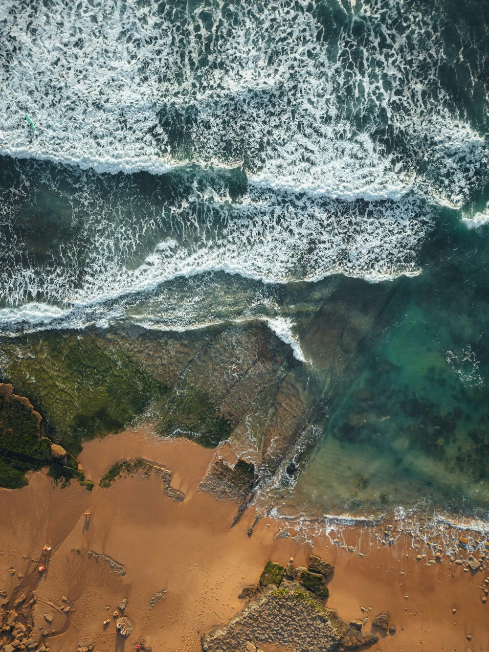 an aerial view of a beach and ocean