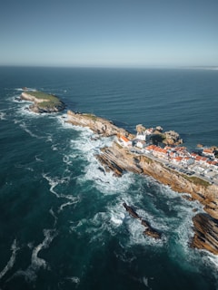 an aerial view of a small town on the coast