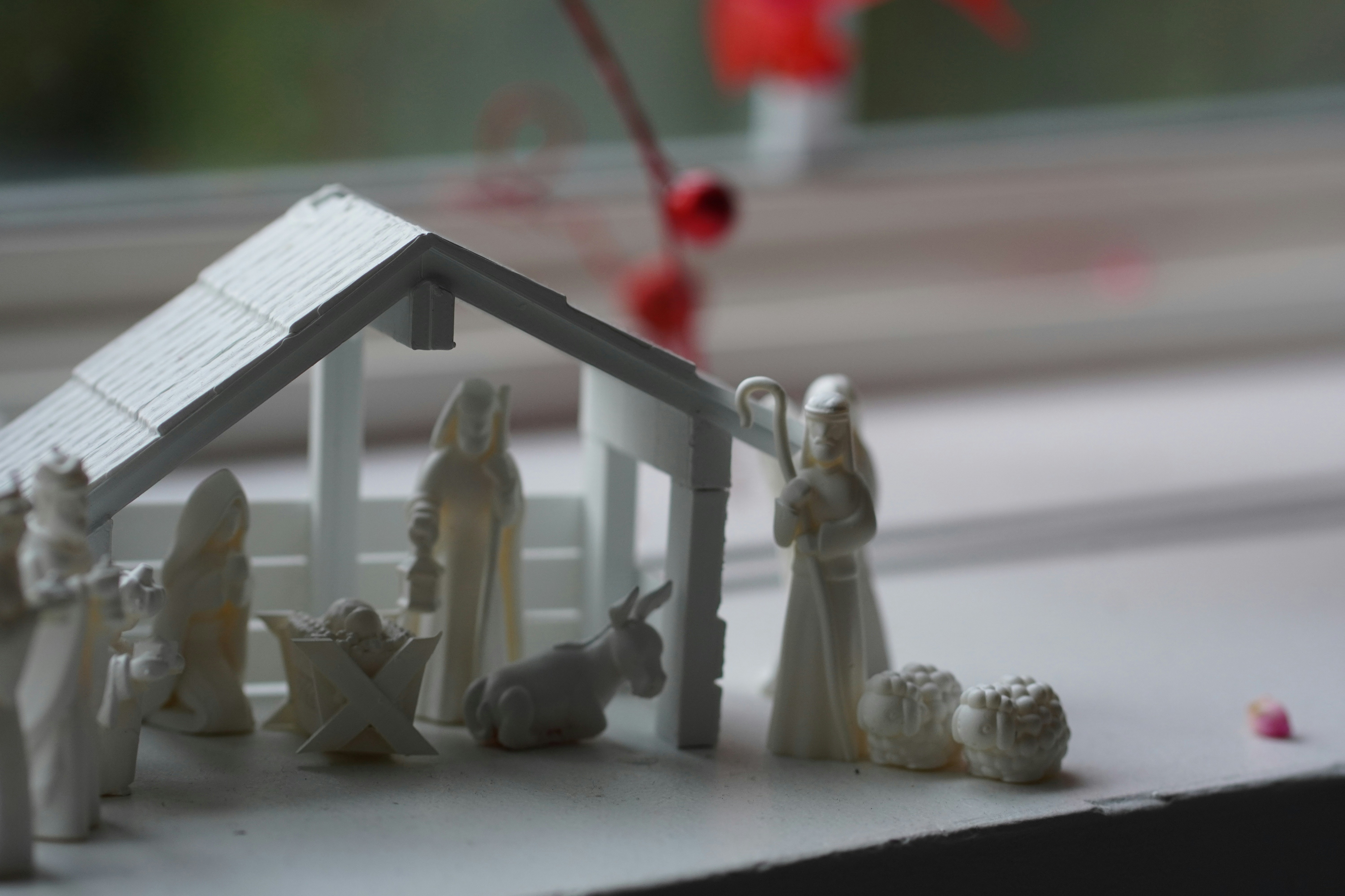 A nativity scene of a house with figurines photo Free Adult Image on