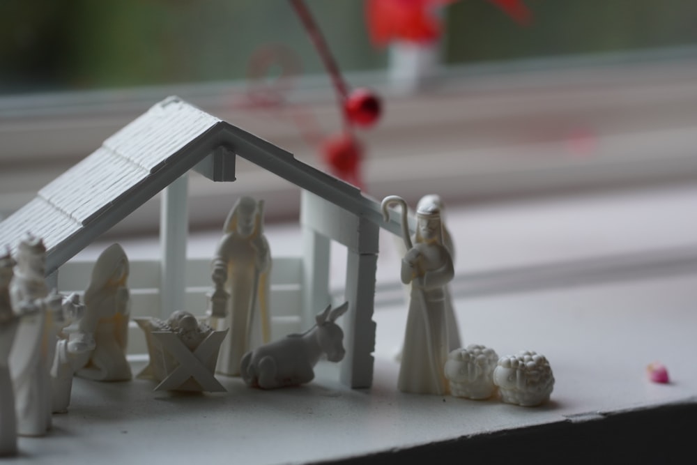 a nativity scene of a house with figurines
