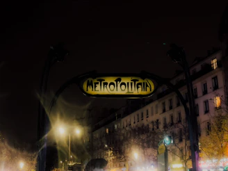 Evening shot of Saint Ouen with city lights and the metro lines highlighted.