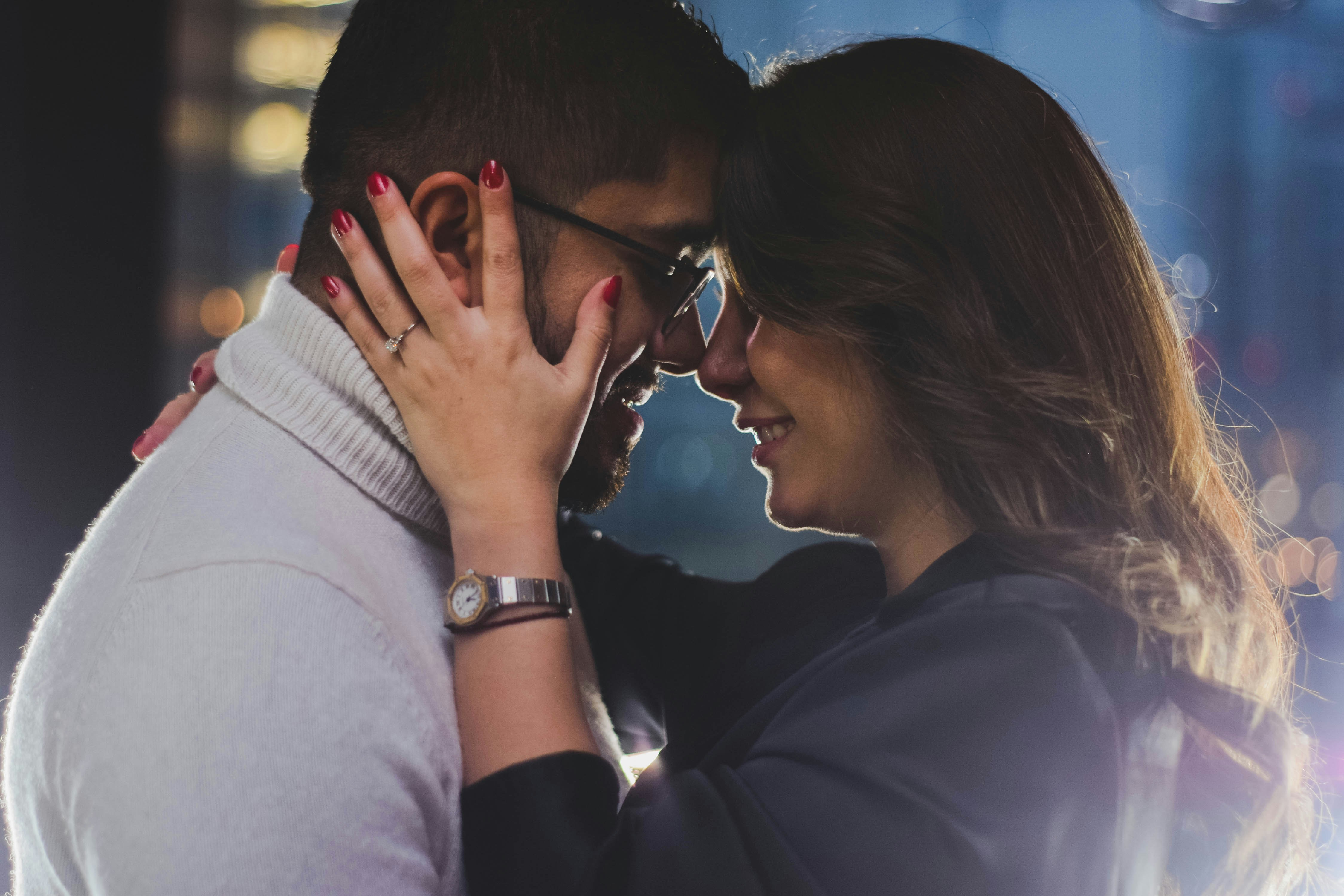 a man and a woman embracing each other