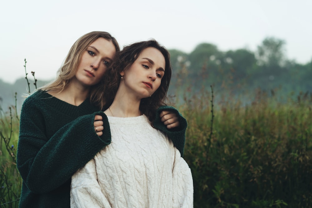 a couple of women standing next to each other