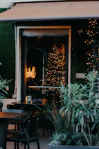 A cozy coffee shop corner with warm lighting and a welcoming atmosphere.