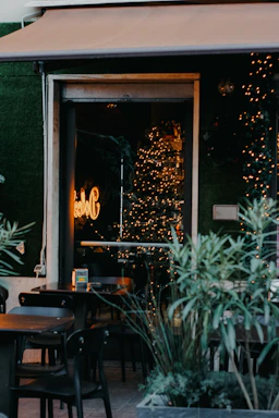 A cozy coffee shop corner with warm lighting and a welcoming atmosphere.