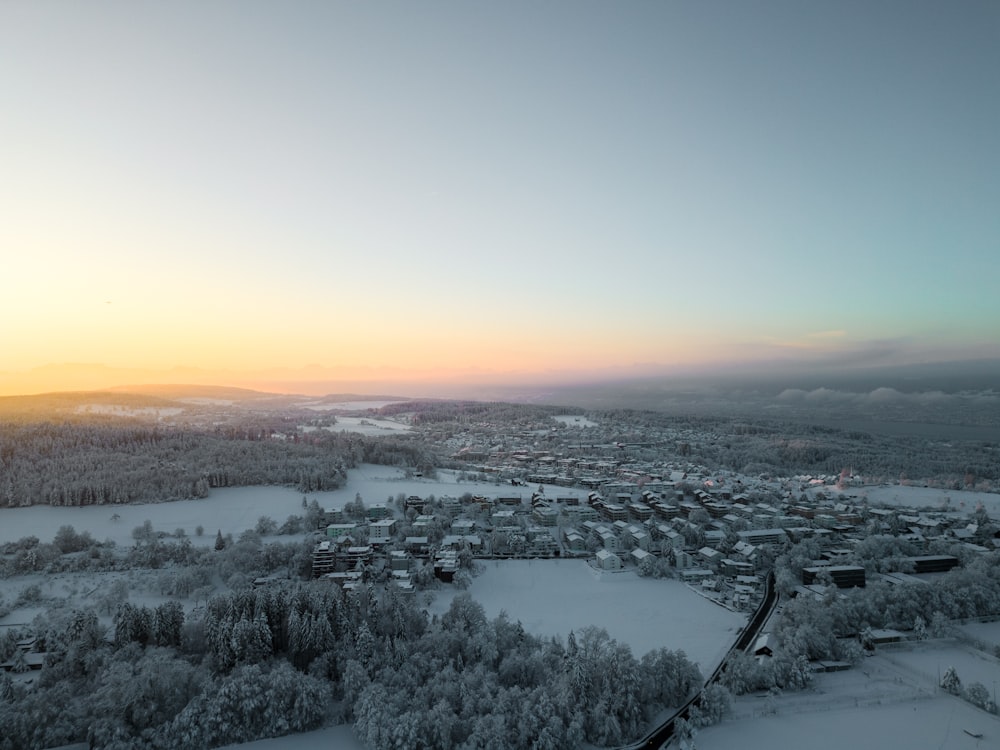 an aerial view of a city in the winter