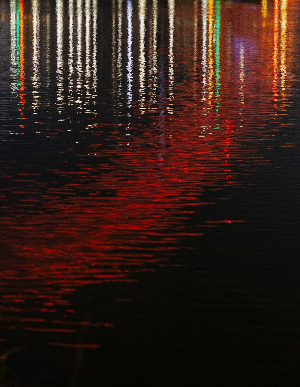 a body of water filled with lots of colorful lights