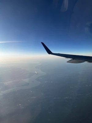 A scenic view from an airplane window during a spontaneous trip.