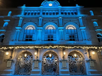 A stylish event entrance illuminated with electric blue lighting and modern decor