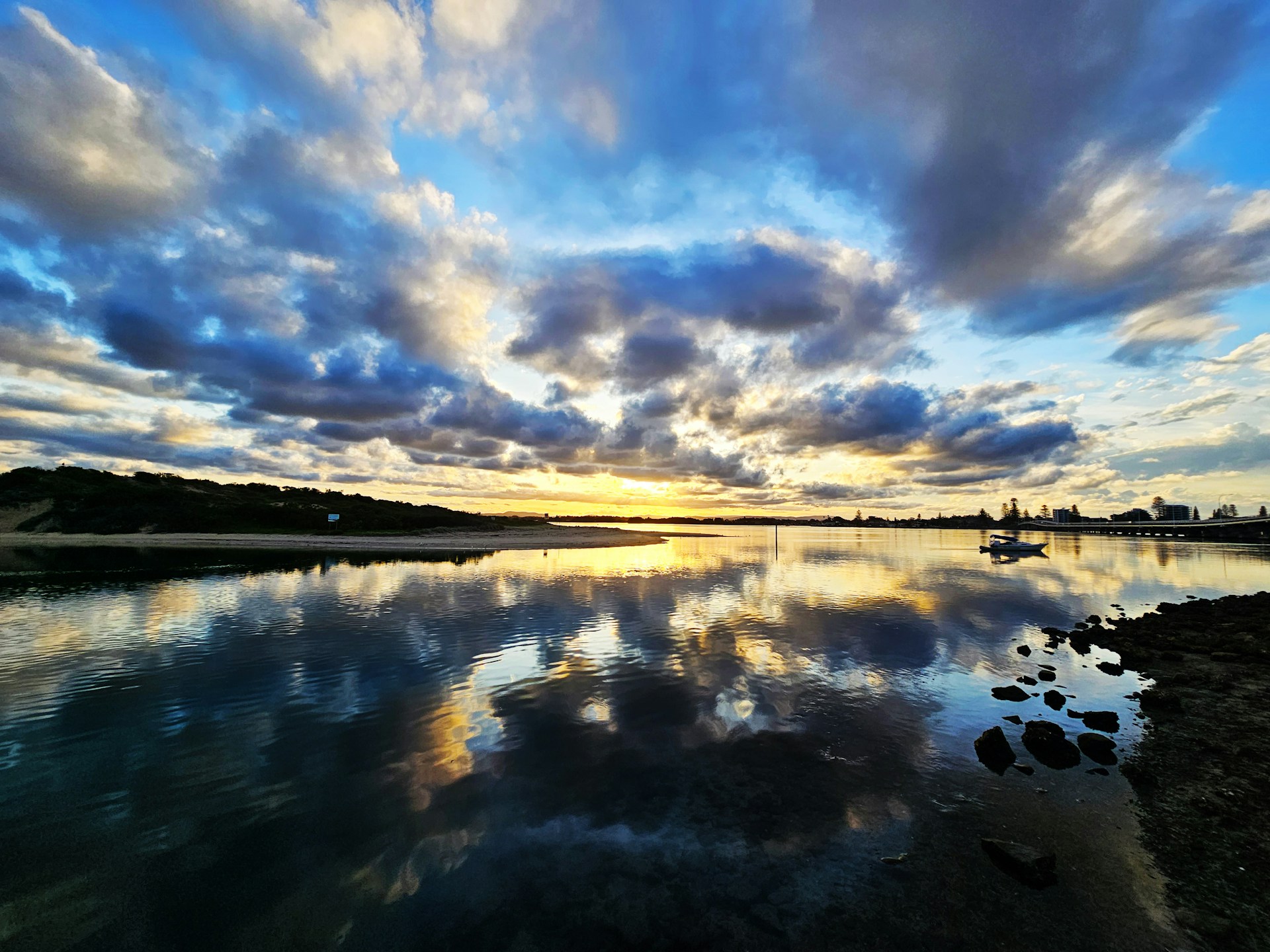 woman wearing yellow long-sleeved dress under white clouds and blue sky during daytime