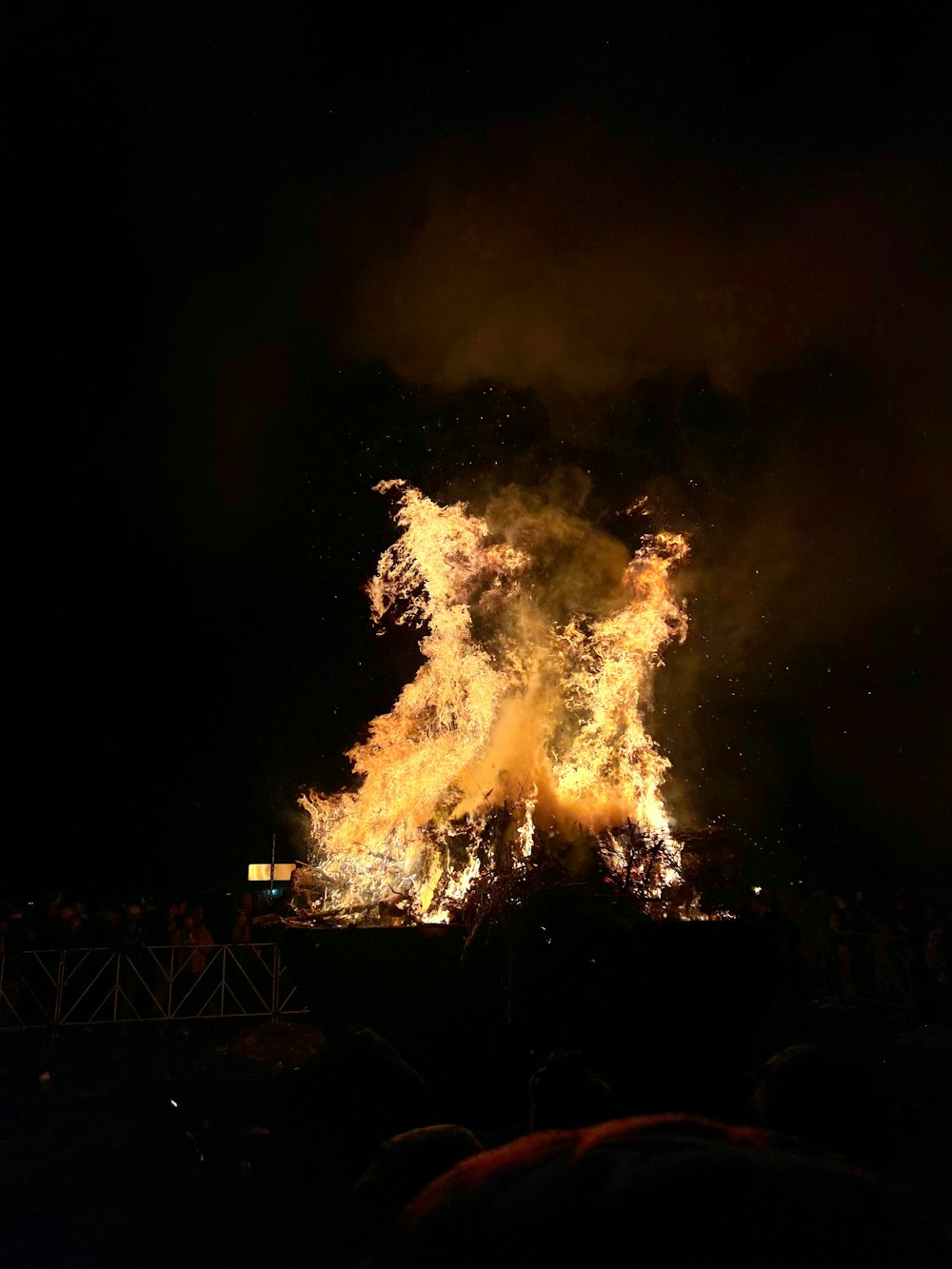 a large fire is lit up in the dark