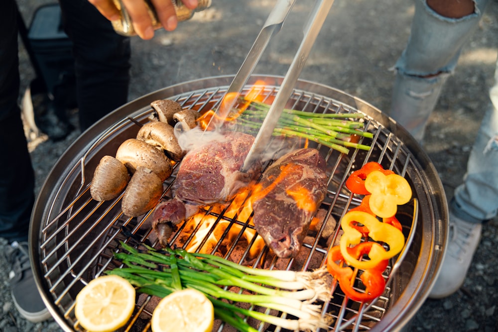 a person is cooking food on a grill