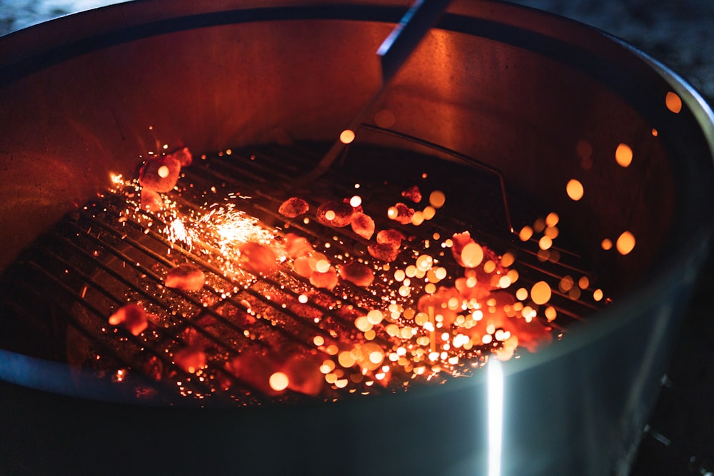 a close up of a grill with some food cooking on it