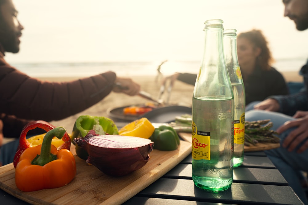 a couple of people sitting at a table with some food