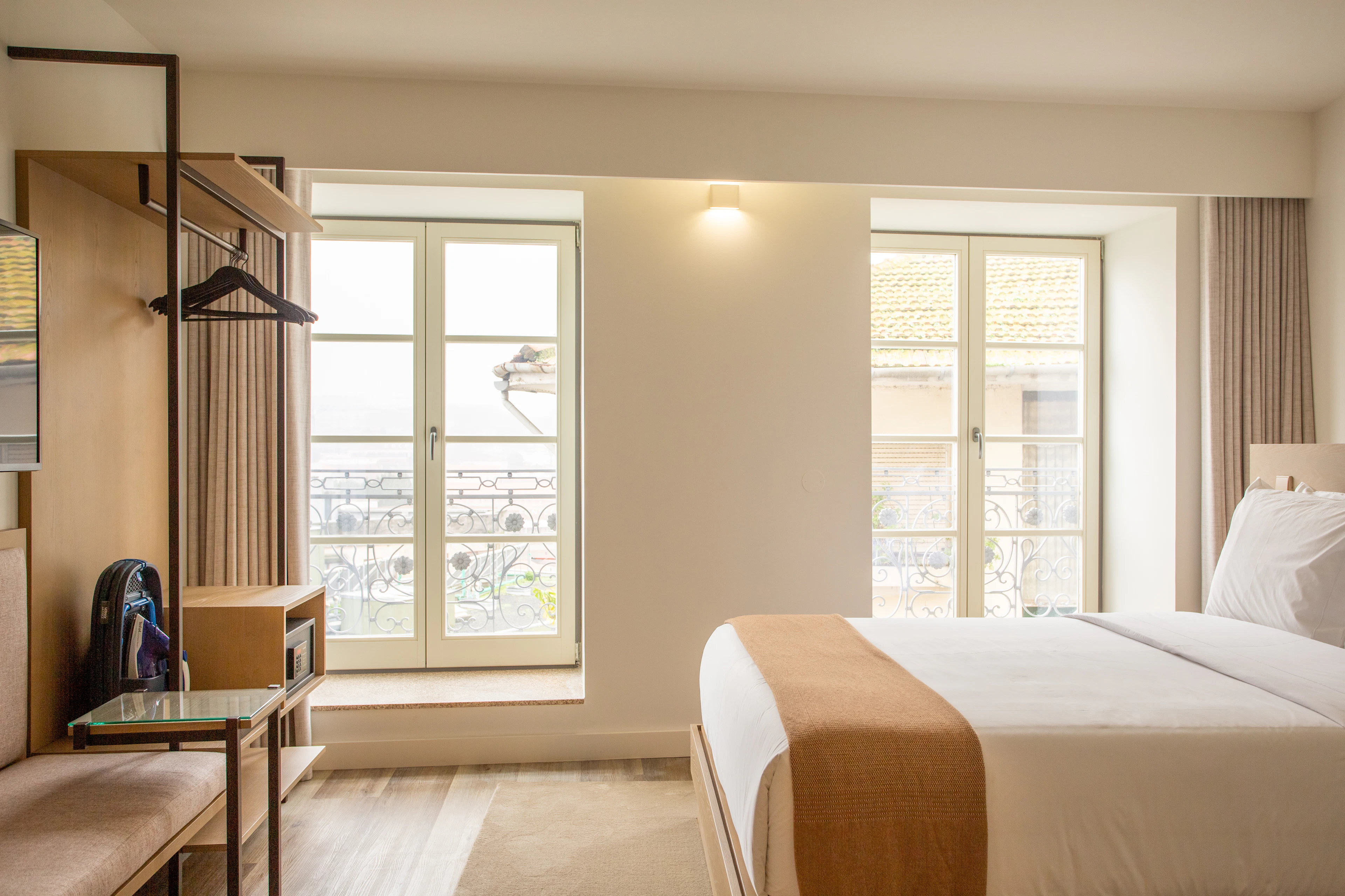 Bedroom with a large bed and a tall window
