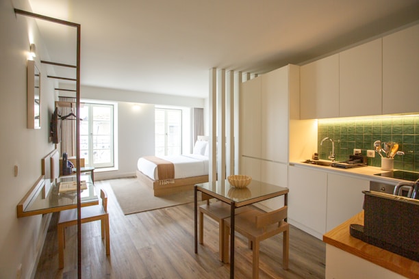 a kitchen with a table and chairs in it