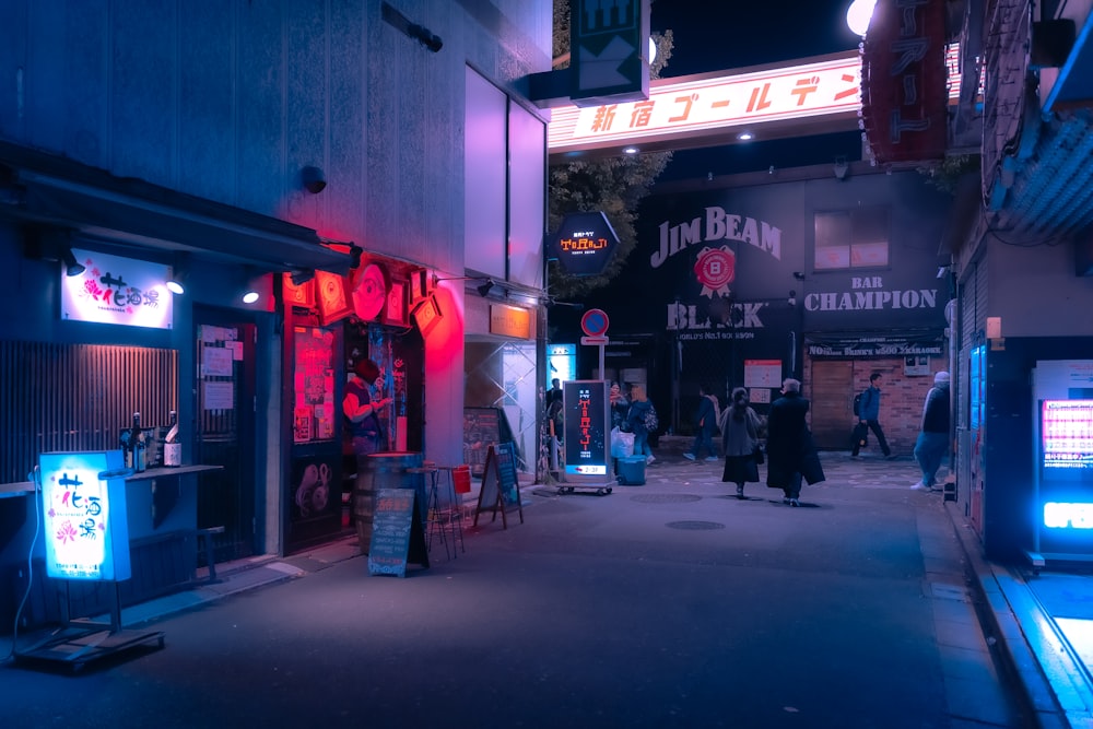 a city street at night with neon lights