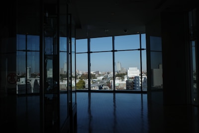 An apartment with a view of the city skyline.
