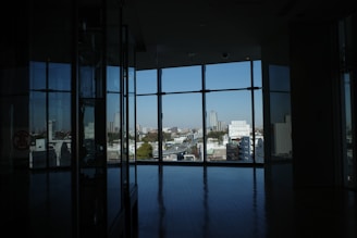 An apartment with a view of the city skyline.