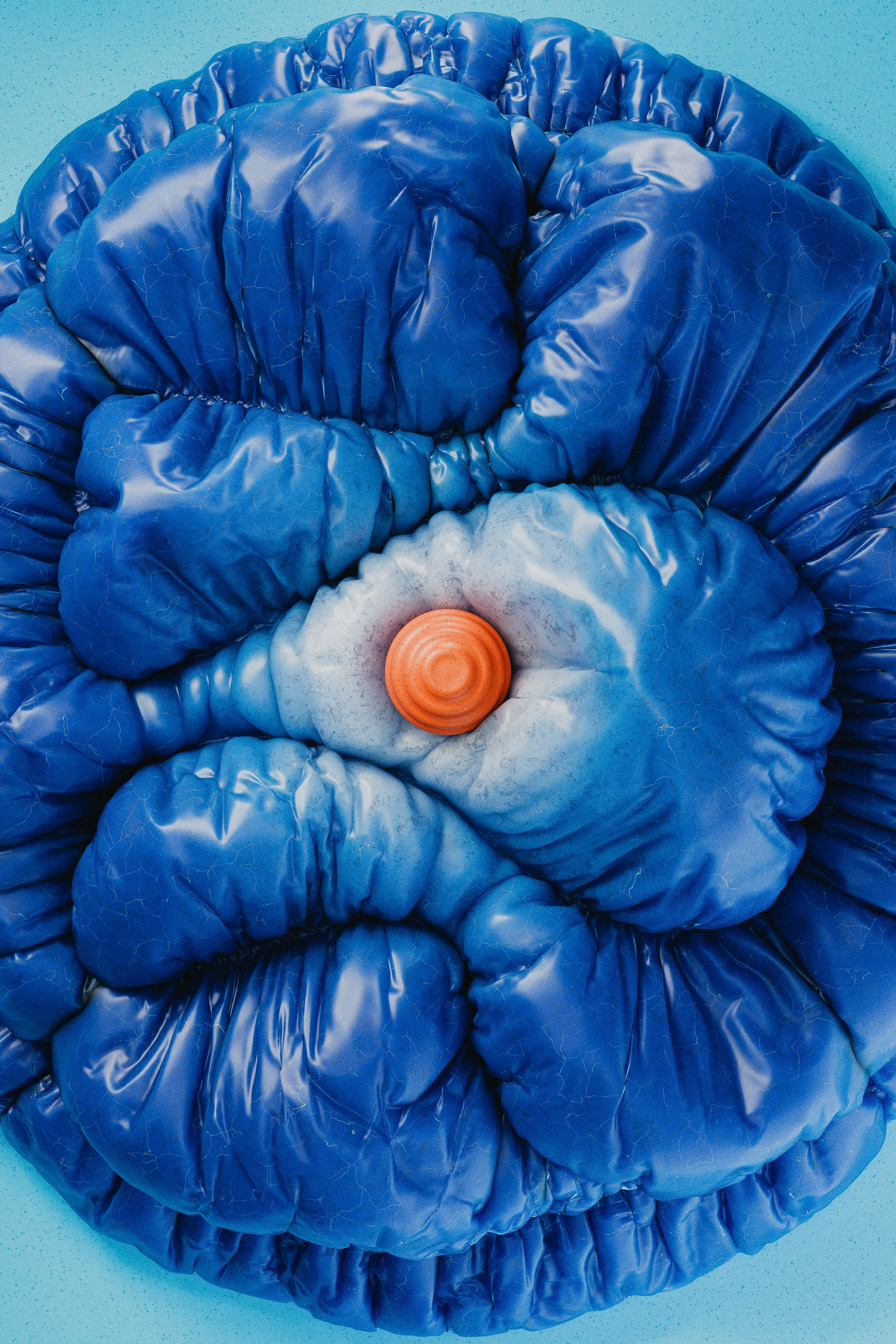 A blue object with an orange object in the middle of it photo – Free ...