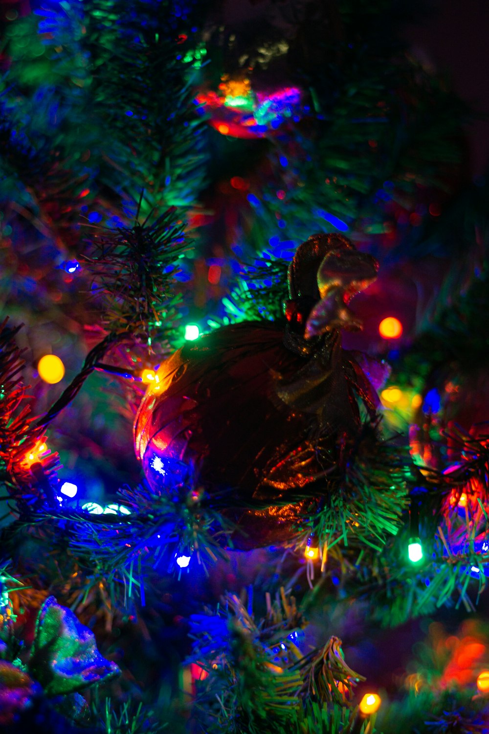 a close up of a christmas tree with lights