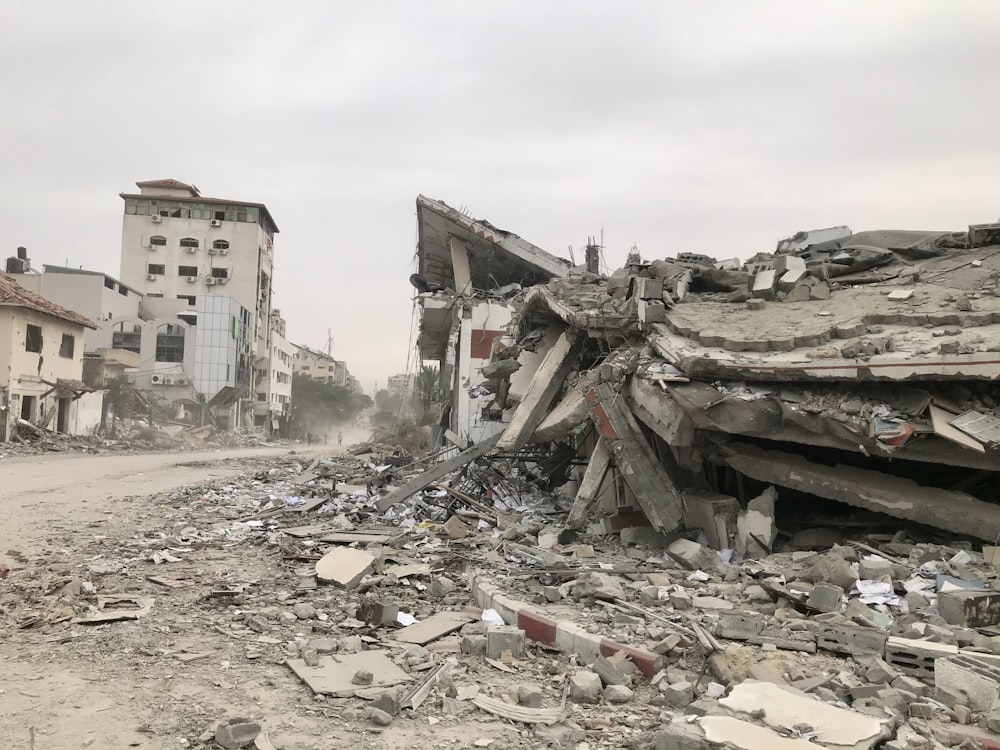 a large pile of rubble sitting on top of a street