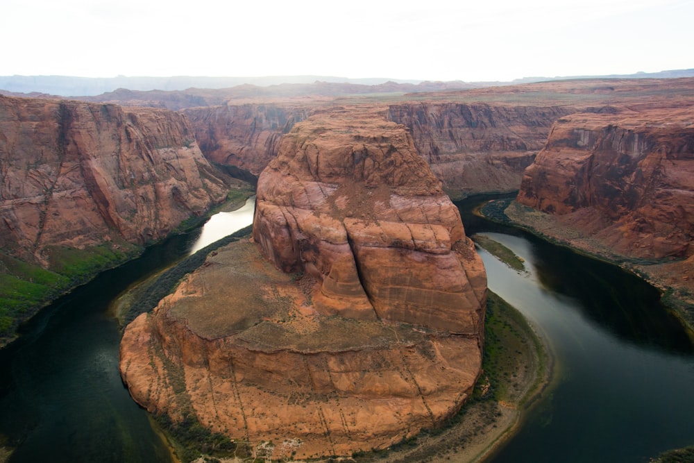 a river flowing through a canyon surrounded by mountains