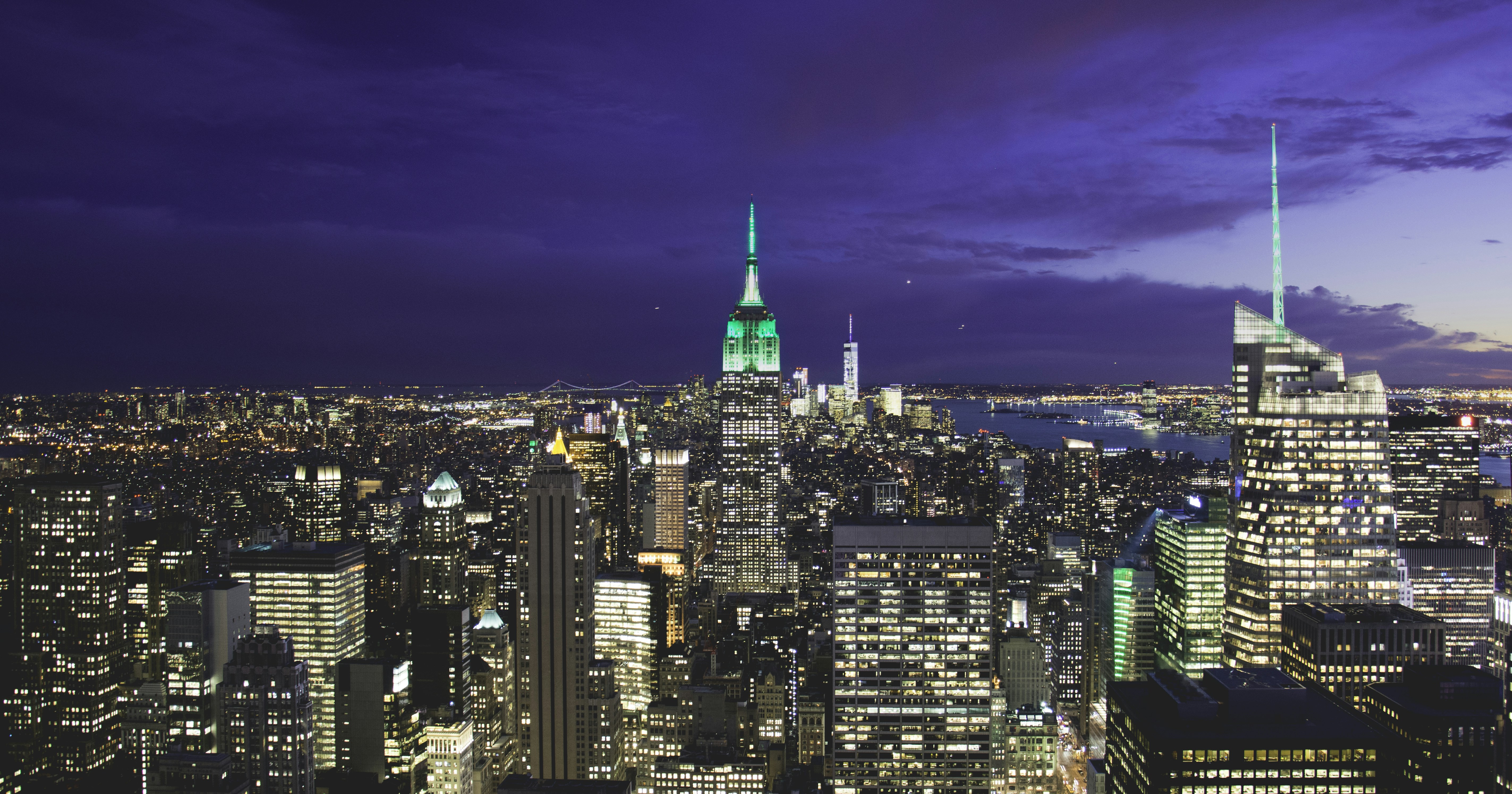 a view of a city at night from the top of a building