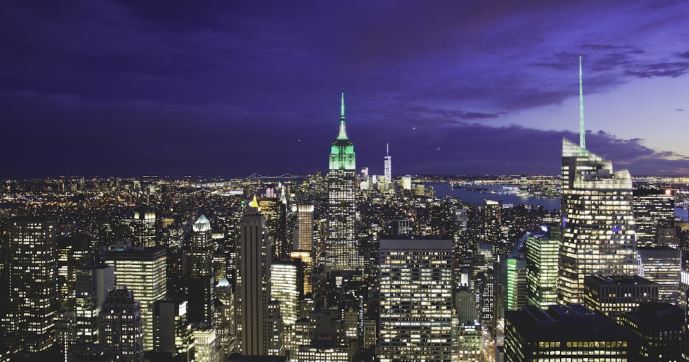 a view of a city at night from the top of a building