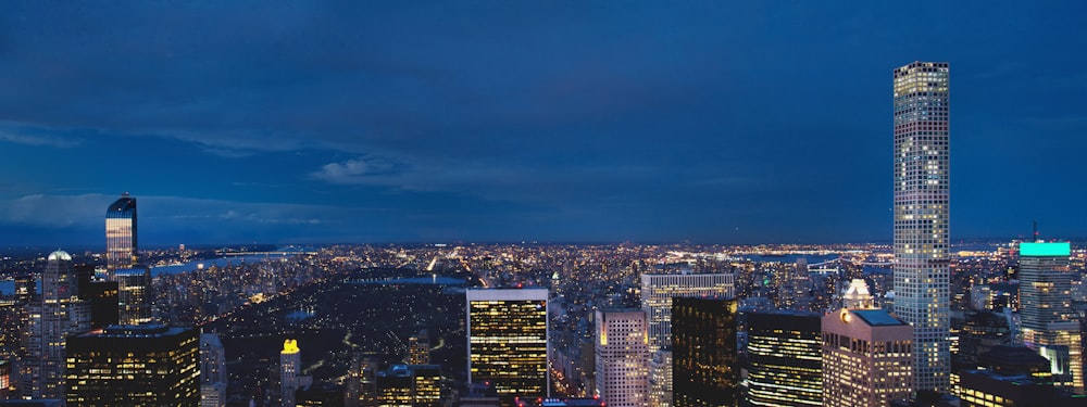 a view of a city at night from the top of a building