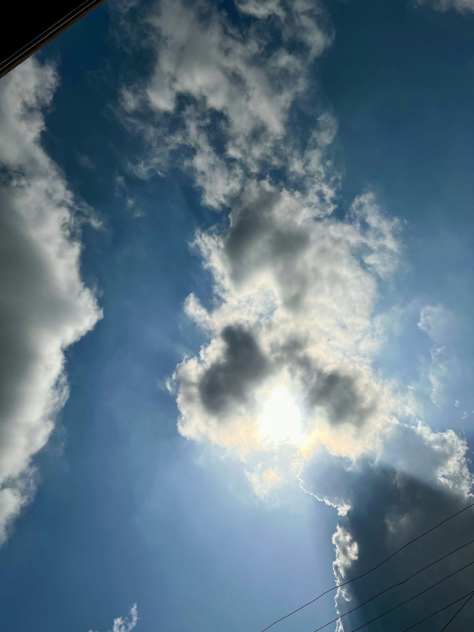 woman wearing yellow long-sleeved dress under white clouds and blue sky during daytime