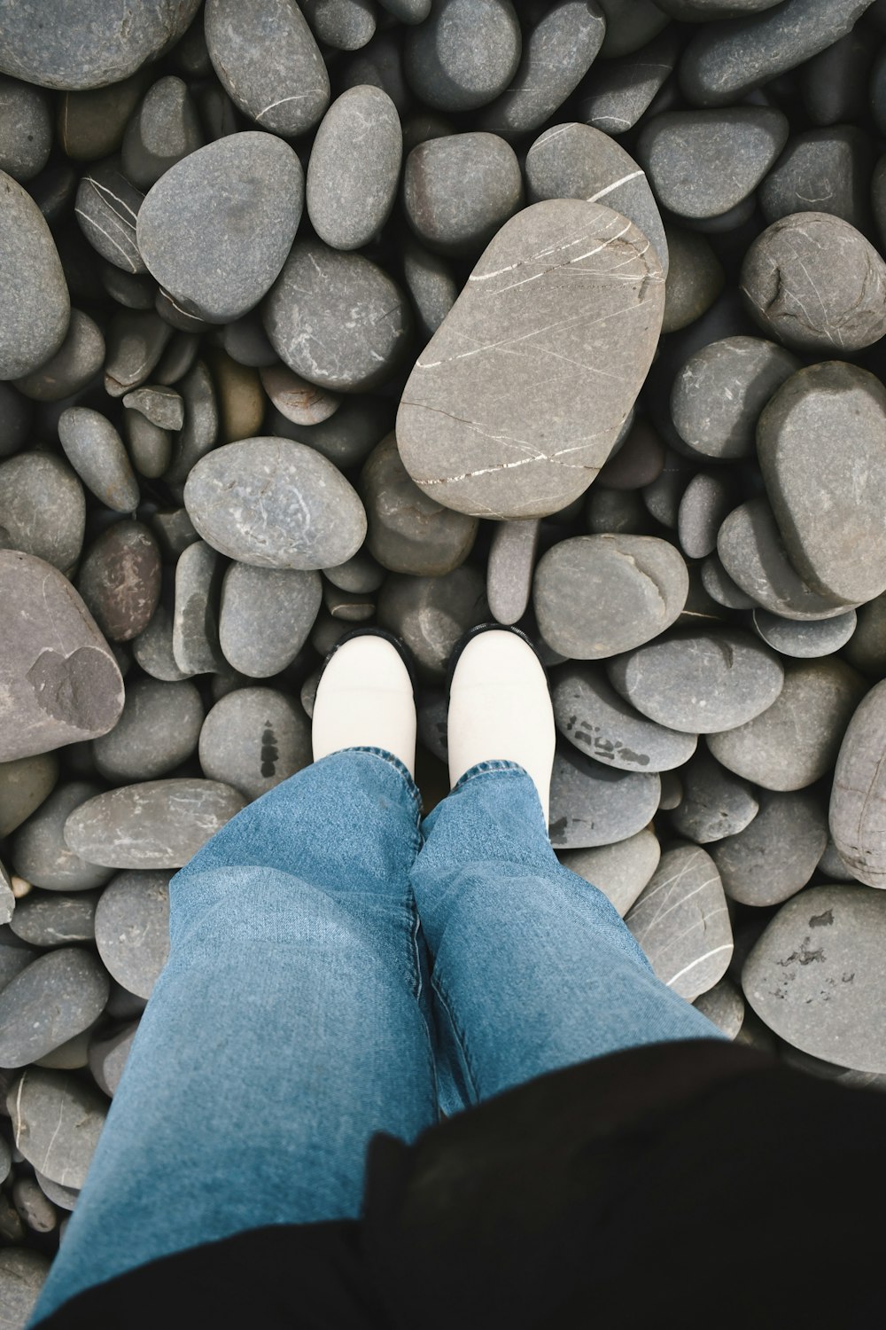 a person standing on top of a pile of rocks