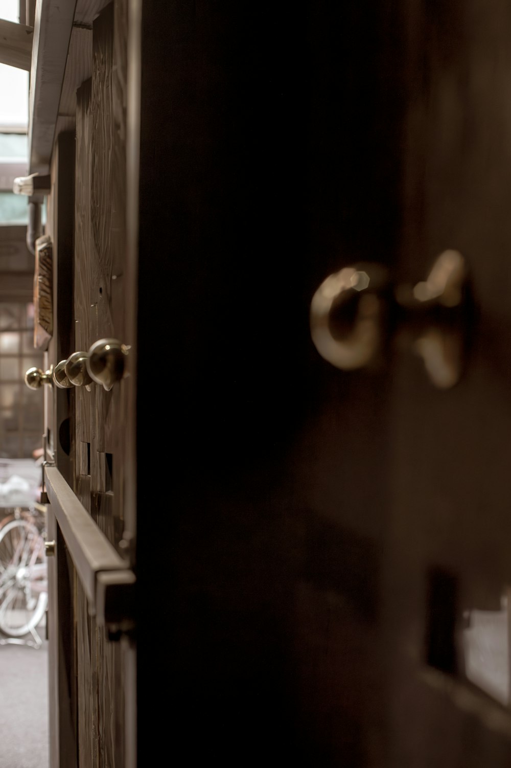 a hallway with a door and a bunch of bikes