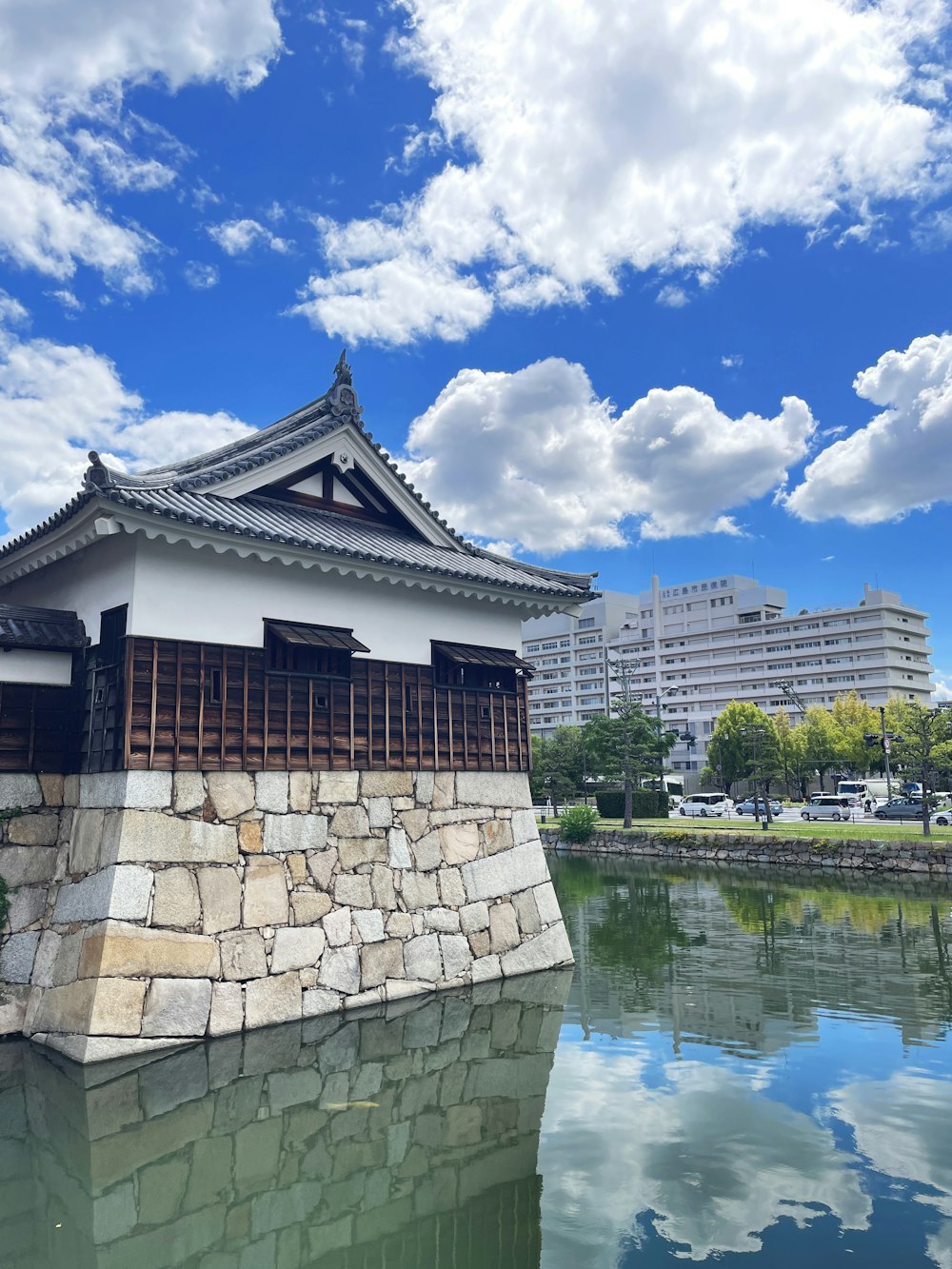 a building sitting next to a body of water