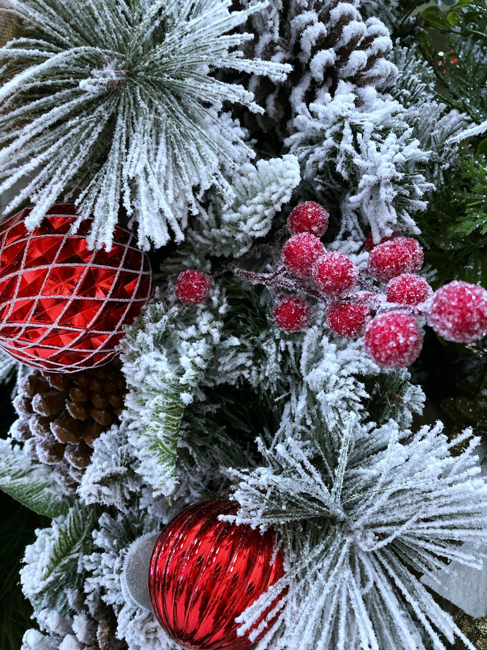 a close up of a christmas tree with ornaments