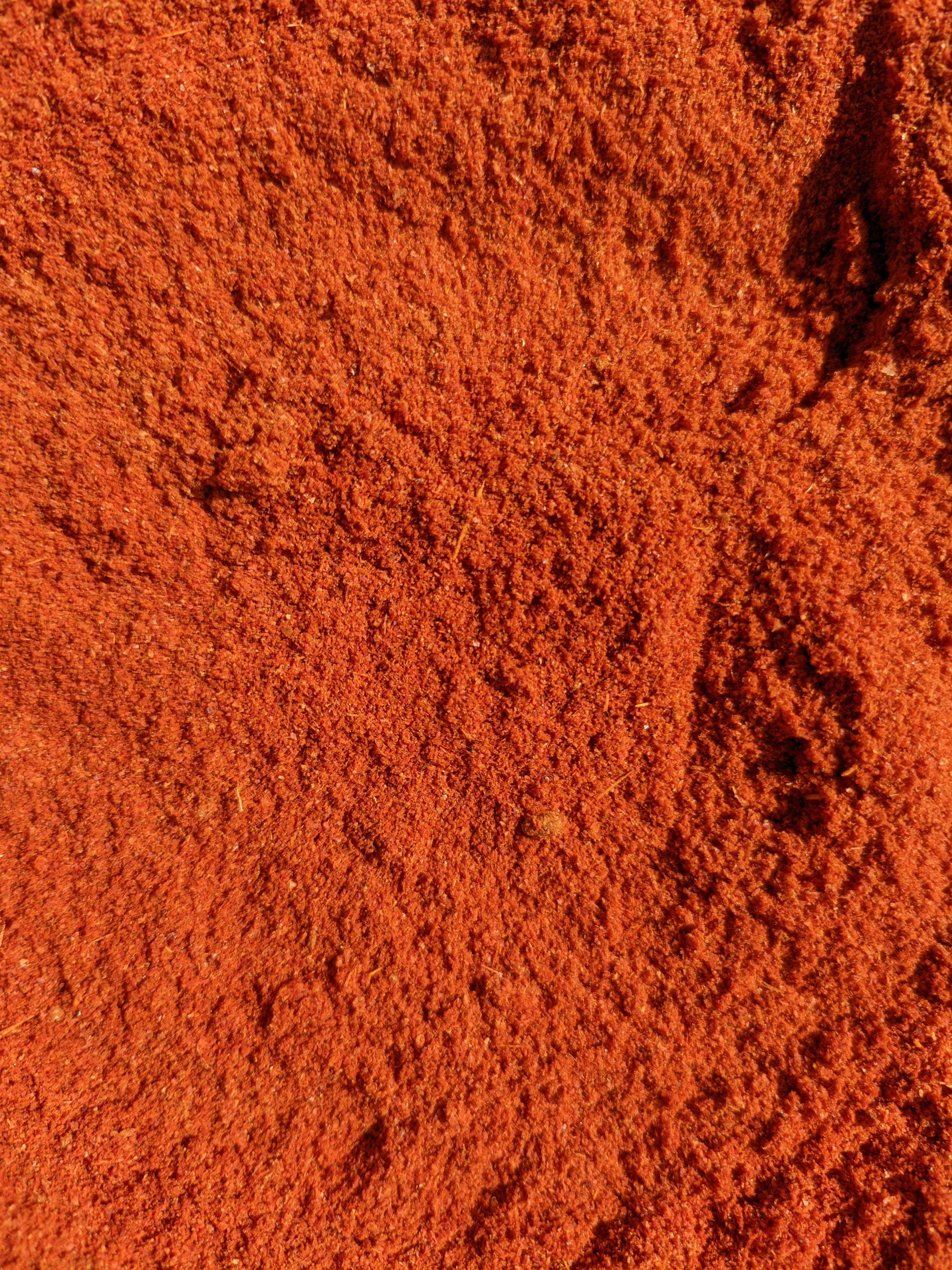 Close-up of bright red chilli powder